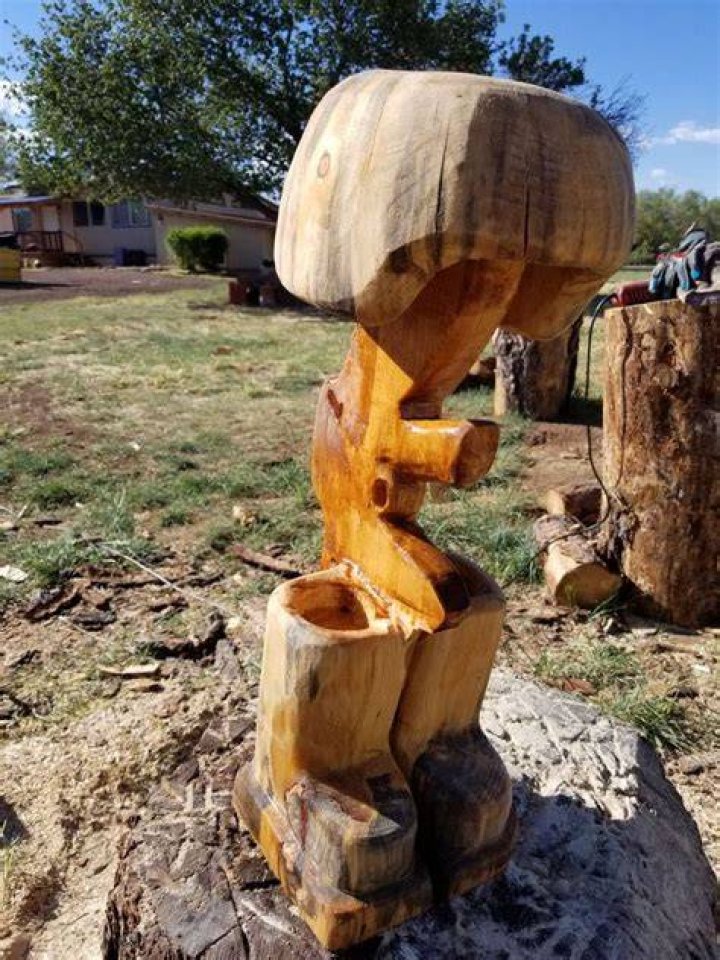 Chainsaw carving, Fallen Soldier, at cemetery of city of Fort Lupton