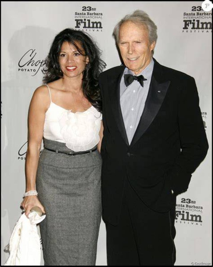 Clint Eastwood and Dina Ruiz arriving at the UK Premiere of Invictus