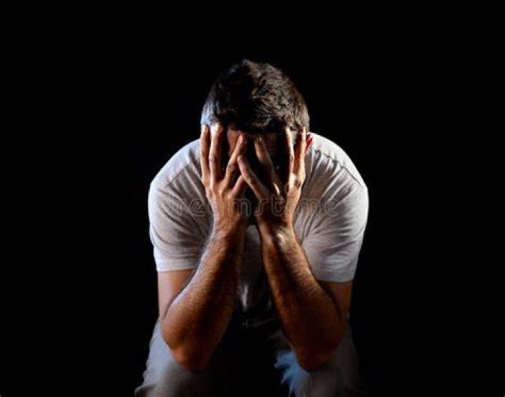 Desperate Man Suffering Emotional Pain, Grief And Deep Depression Stock