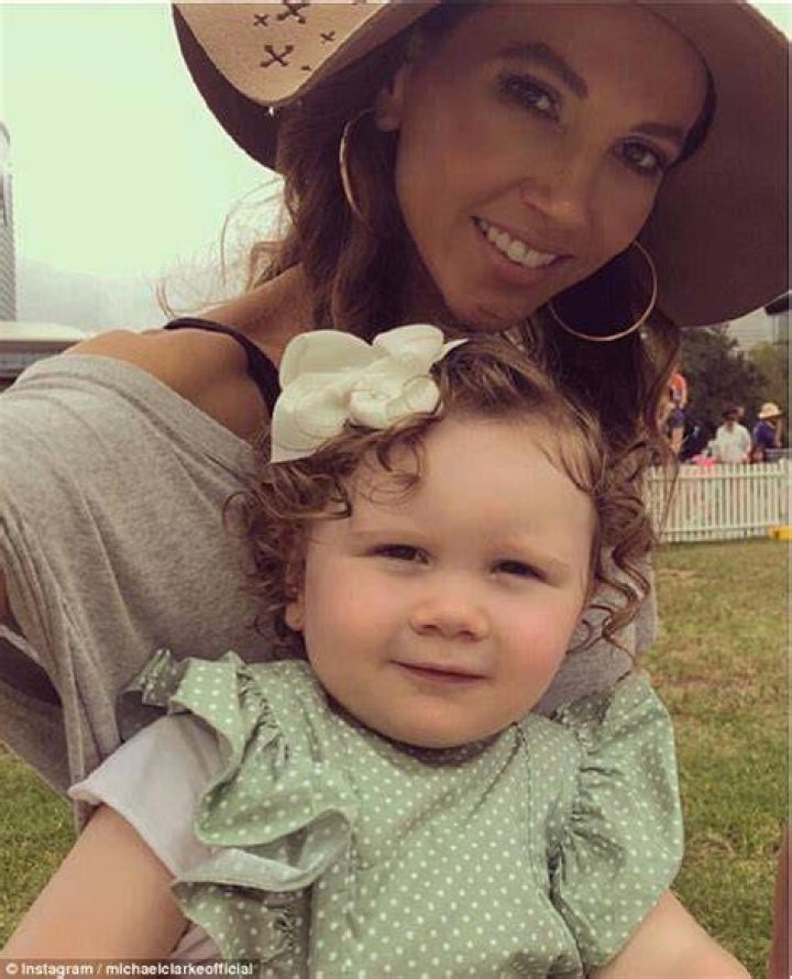 Kyly Clarke cradles her sevenmonth baby bump at SunSCHine charity ball