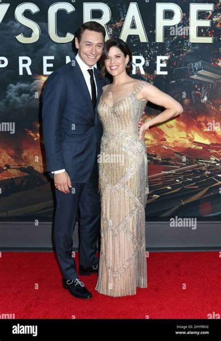 Neve Campbell & husband JJ Feild attending the Skyscraper New York