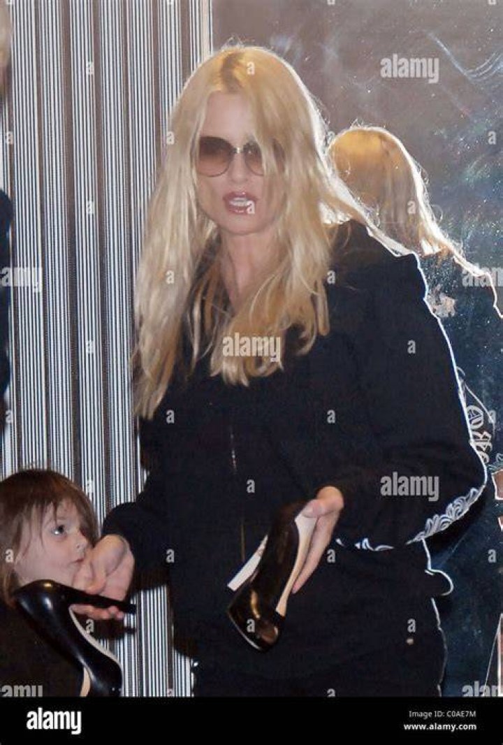 Nicollette Sheridan has her hands full as she shops for shoes with her