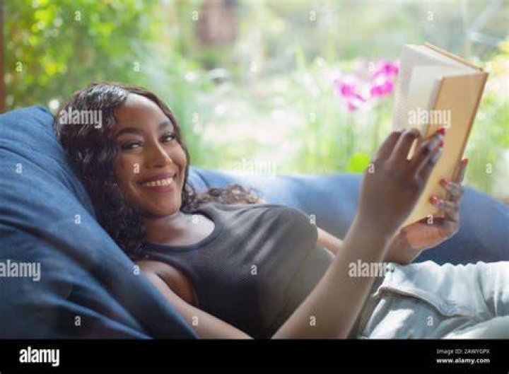 Young Woman Reading And Relaxing Stock Photo Image of phayam, siesta
